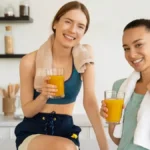 Two girls, after a work out, drinking EDG3 Plus to enjoy its benefits of glutathione for immunity