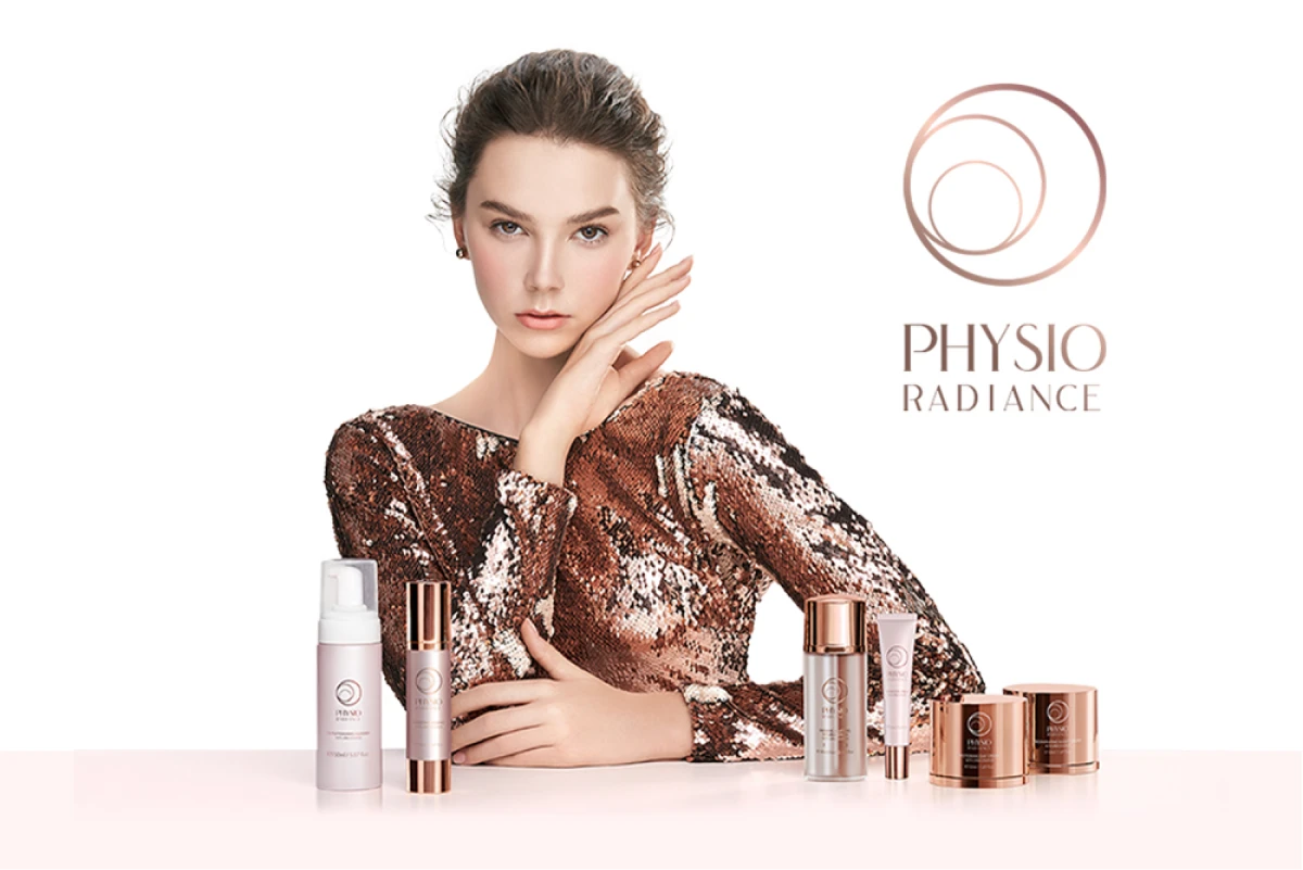 Model posing with the Physio Radiance skincare line
