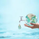 A woman holding a globe with a faucet, promoting water conservation through awareness