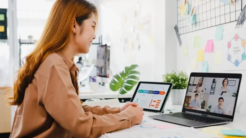 Girl accessing qlearn online courses for upskilling on her tablet and laptop