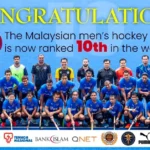 malaysian hockey team posing to celebrate being ranked 10th in the world