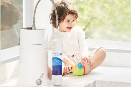 A joyful toddler on a table with toy, alongside HomePure Viva, encouraging a cheerful and healthful lifestyle.