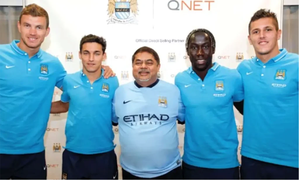 QNET Founder Vijay Eswaran (middle) poses with Manchester City players (left to right) Edin Dzeko, Jesus Navas, Bacary Sagna and Stevan Jovetic to celebrate Manchester City Partnership