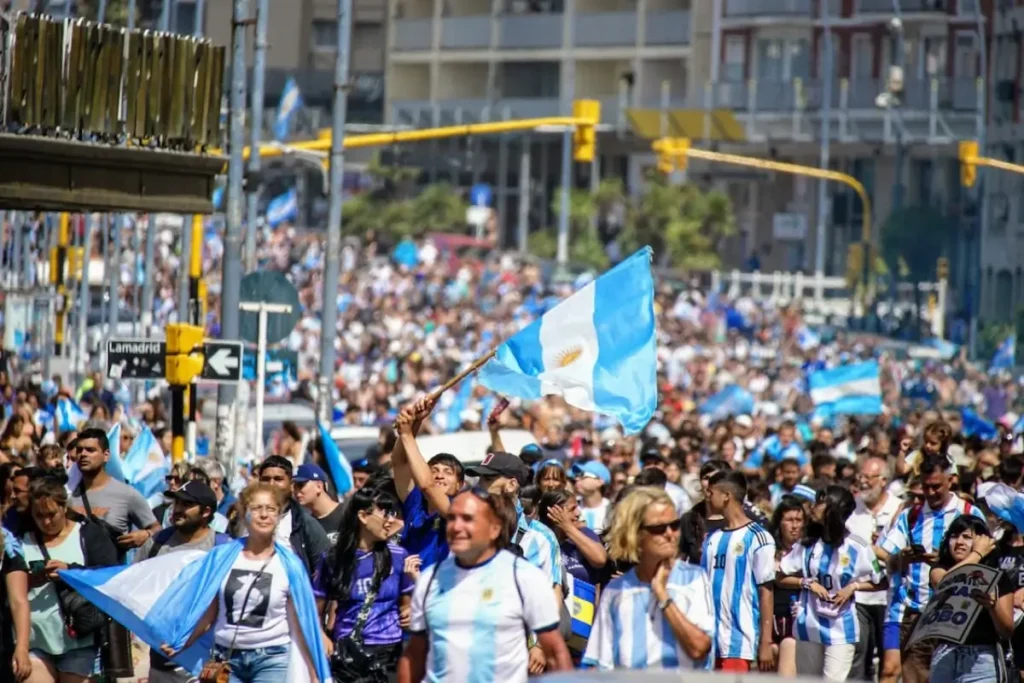 Crowd of argentinian football fan walking in the city 