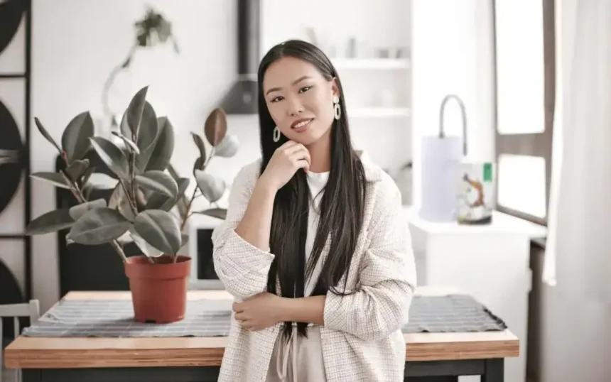 Woman sitting on office desk thinking