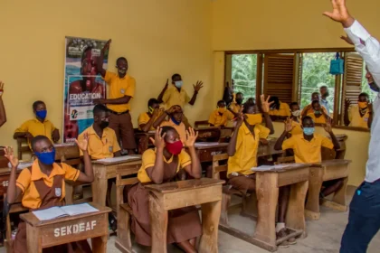 Children in Ghana learning inside a classroom, with the support of ANOPA, QNET and RYTHM Foundation