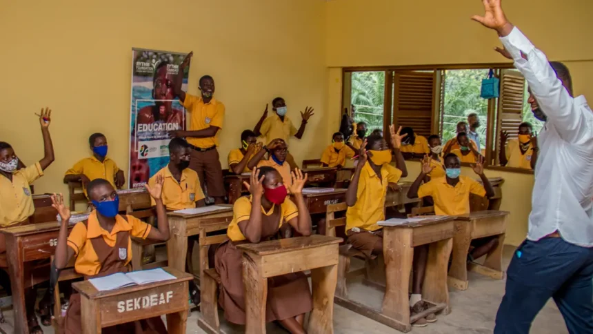 Children in Ghana learning inside a classroom, with the support of ANOPA, QNET and RYTHM Foundation