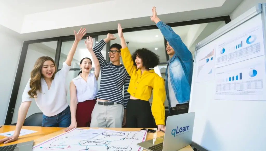 young entrepreneurs celebrating in office room 