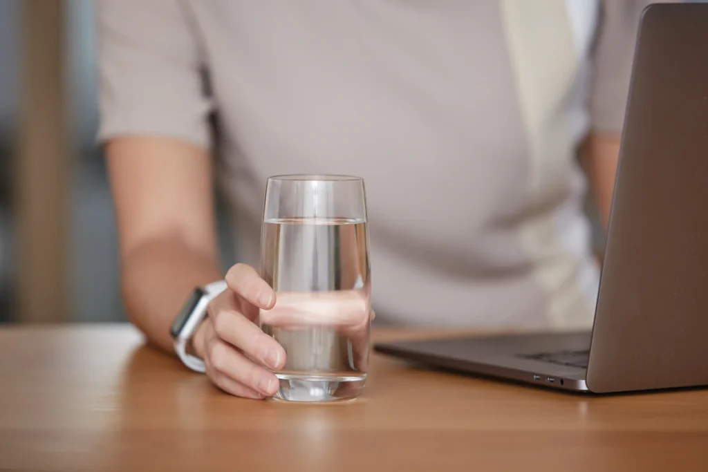 Woman holding homepure viva water glass