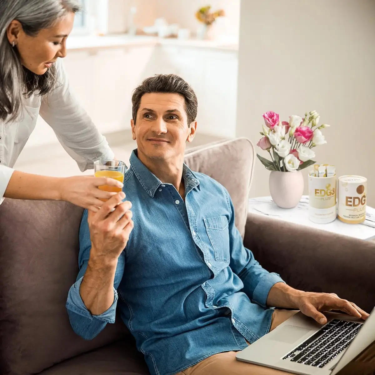 Woman handing hand glass of EDGE Plus