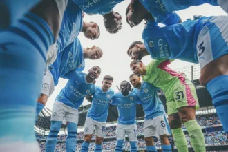 QNET-ManCity players, who have just been named Champions of the World 2023, huddle up before a game
