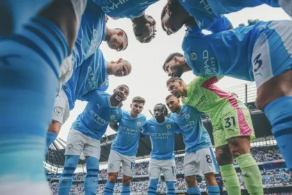 QNET-ManCity players, who have just been named Champions of the World 2023, huddle up before a game