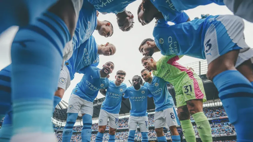 QNET-ManCity players, who have just been named Champions of the World 2023, huddle up before a game