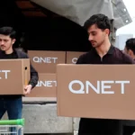 QNET Ramadan 2023 - Men carrying donation packages