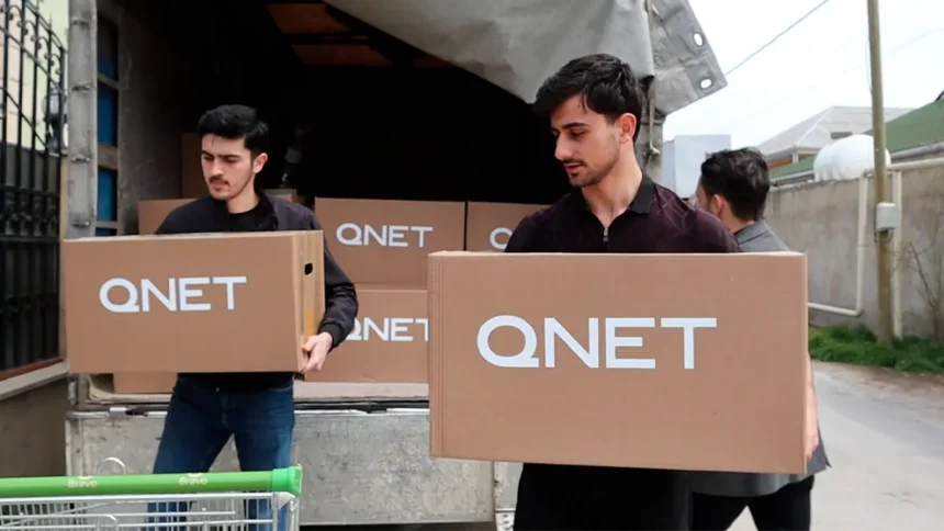 QNET Ramadan 2023 - Men carrying donation packages