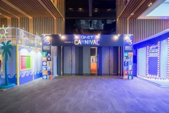 The vibrant entrance of the QNET Carnival, showcasing our commitment to sustainability at V-Convention 2023