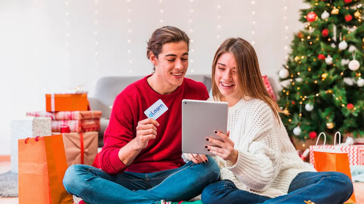 Young man and woman excited about starting a qLearn course, one of the QNET products you can give to gift the good life to family and friends