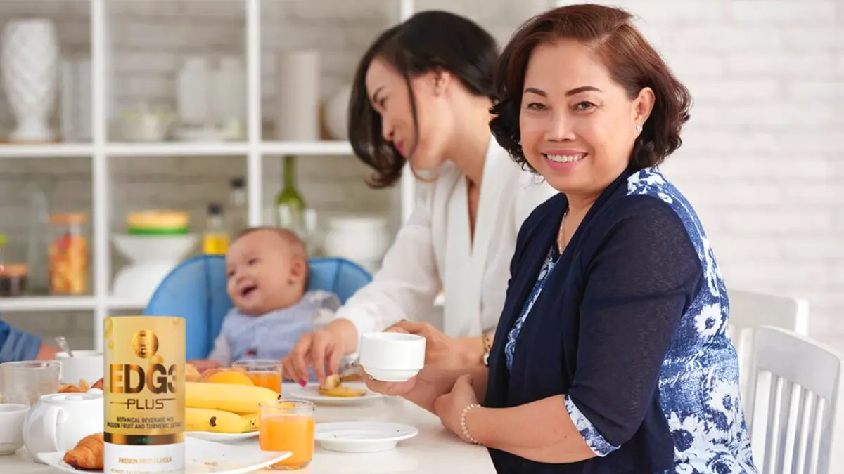 Grandmom, mom, and baby at the breakfast table, with EDG3 Plus served to help boost the adults' levels of glutathione for immunity