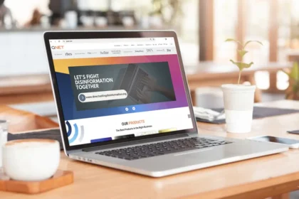 Laptop showing official website to showing QNET website not QNET scams website