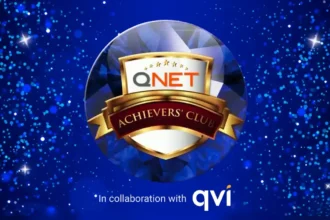 QNET Sapphire Star version of the Achievers Club logo; the banner also says in collaboration with QVI