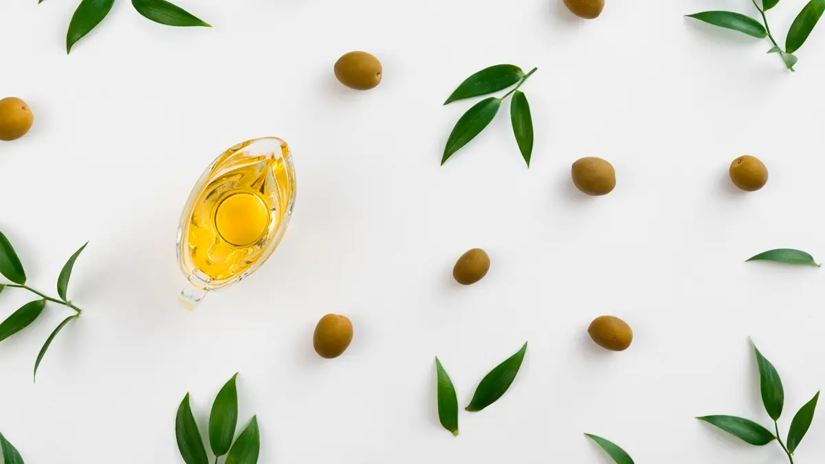 Olives and olive leaves flat lay 