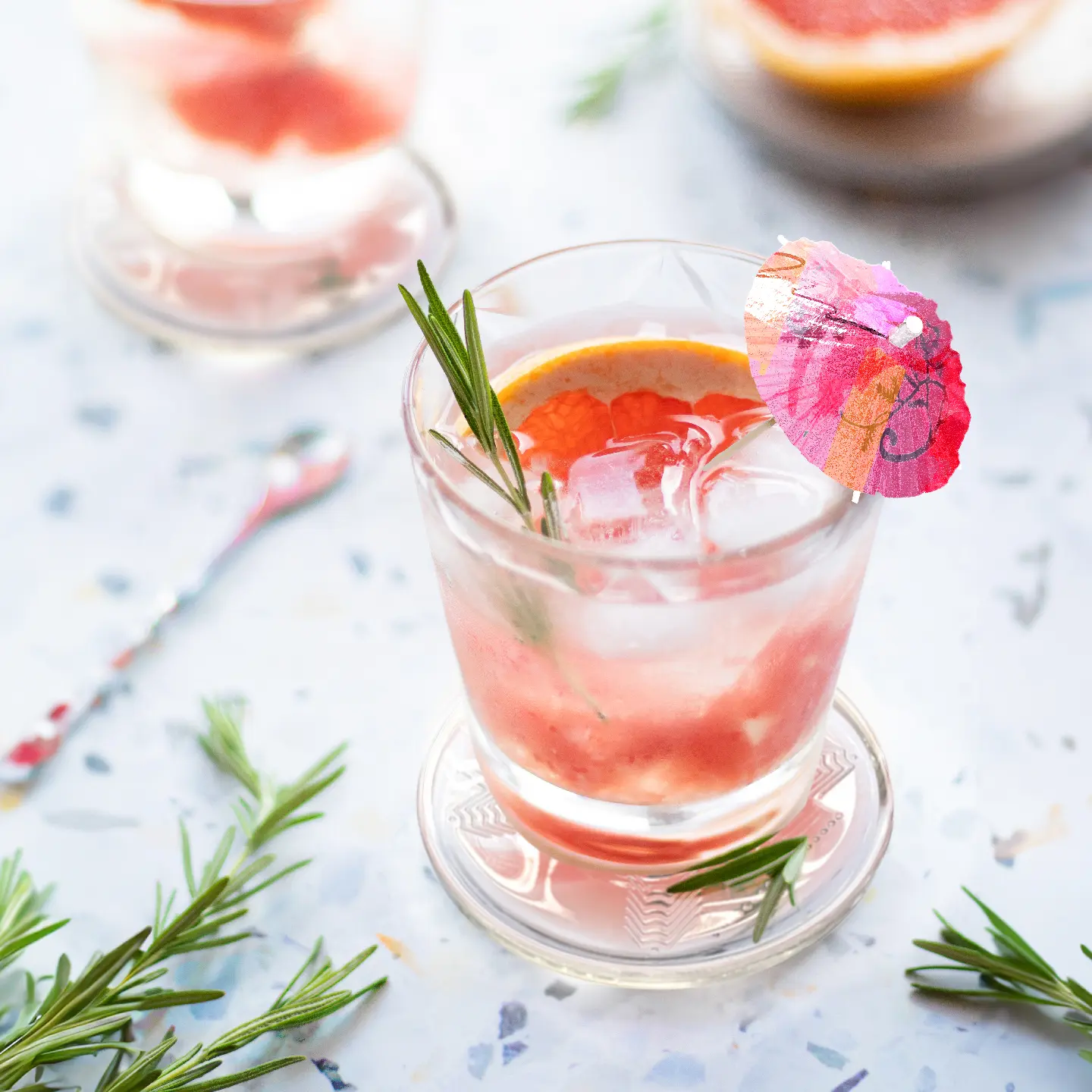 Glass of tangerine- and rosemary-infused water on top of Amezcua Bio Disc 3