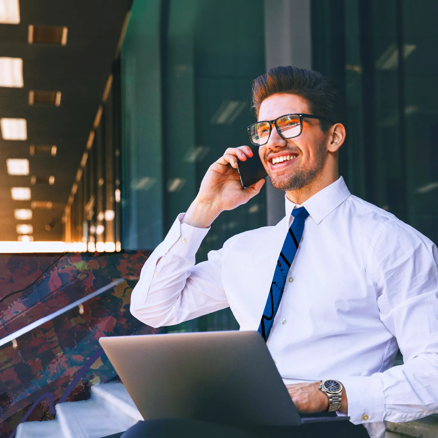 Man wearing a Bernhard H. Mayer watch as he takes a call while working