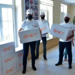 Representatives from QNET, through RYTHM Foundation, donate goods for Ramadan 2021