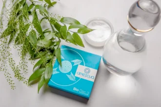 Amezcua Bio Disc 3 beside a bottle of water and plants
